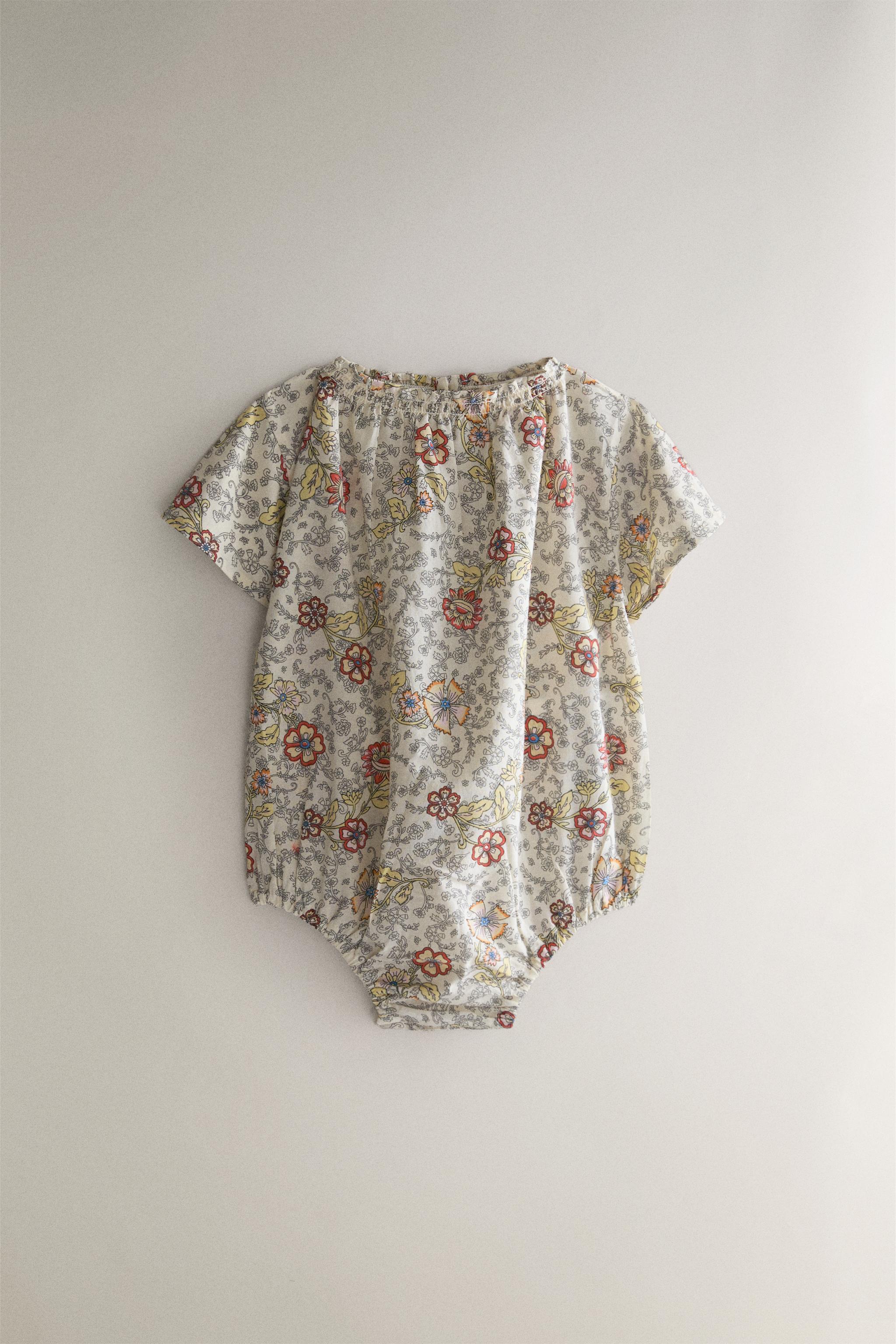 BABY FLORAL FOOTED ROMPER